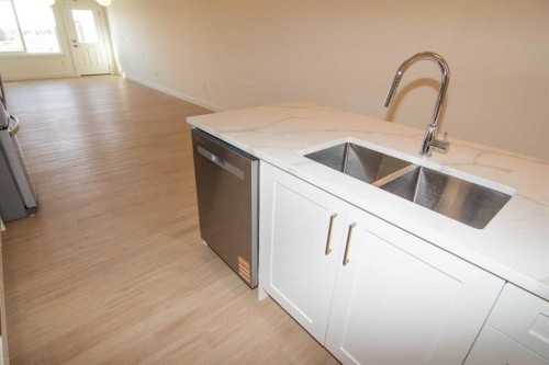 31 Wolf Crescent, Okotoks, AB - Indoor Photo Showing Kitchen With Double Sink