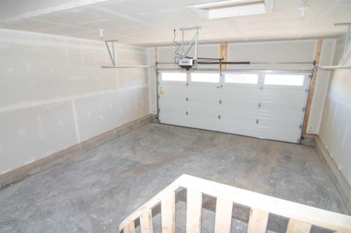 31 Wolf Crescent, Okotoks, AB - Indoor Photo Showing Garage