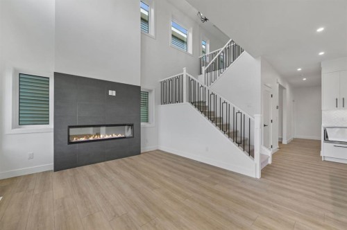 135 Walgrove Bay Se, Calgary, AB - Indoor Photo Showing Living Room With Fireplace