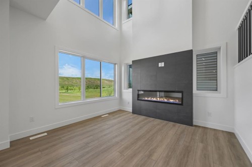 135 Walgrove Bay Se, Calgary, AB - Indoor Photo Showing Living Room With Fireplace
