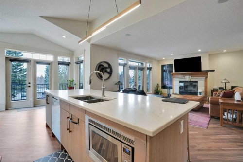 5107 Carney Road Nw, Calgary, AB - Indoor Photo Showing Kitchen With Fireplace With Double Sink