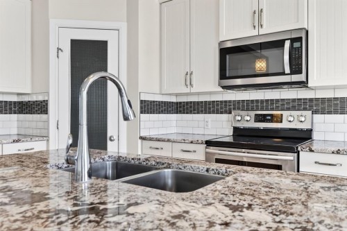 123 Evanscrest Way Nw, Calgary, AB - Indoor Photo Showing Kitchen With Stainless Steel Kitchen With Double Sink With Upgraded Kitchen