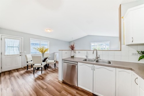 118 Bridleridge Way Sw, Calgary, AB - Indoor Photo Showing Kitchen With Double Sink