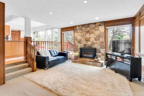 195 Ranch Estates Road Nw, Calgary, AB - Indoor Photo Showing Living Room With Fireplace
