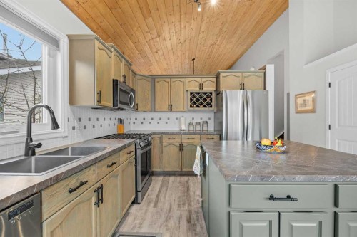 64 Arbour Ridge Way Nw, Calgary, AB - Indoor Photo Showing Kitchen With Stainless Steel Kitchen With Double Sink