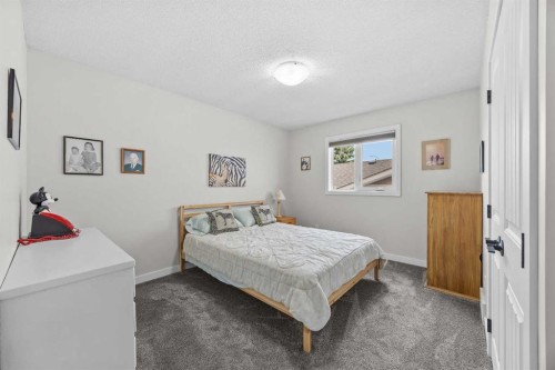 64 Arbour Ridge Way Nw, Calgary, AB - Indoor Photo Showing Bedroom