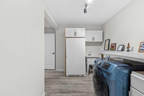 64 Arbour Ridge Way Nw, Calgary, AB - Indoor Photo Showing Laundry Room