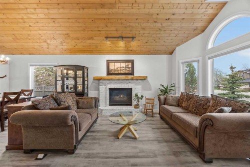 64 Arbour Ridge Way Nw, Calgary, AB - Indoor Photo Showing Living Room With Fireplace
