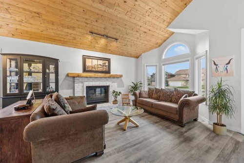 64 Arbour Ridge Way Nw, Calgary, AB - Indoor Photo Showing Living Room With Fireplace