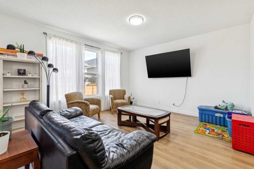 12 Copperhead Garden Se, Calgary, AB - Indoor Photo Showing Living Room