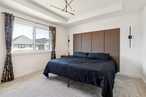 12 Copperhead Garden Se, Calgary, AB - Indoor Photo Showing Bedroom
