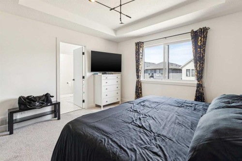 12 Copperhead Garden Se, Calgary, AB - Indoor Photo Showing Bedroom