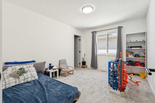 12 Copperhead Garden Se, Calgary, AB - Indoor Photo Showing Bedroom