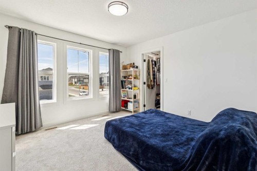 12 Copperhead Garden Se, Calgary, AB - Indoor Photo Showing Bedroom