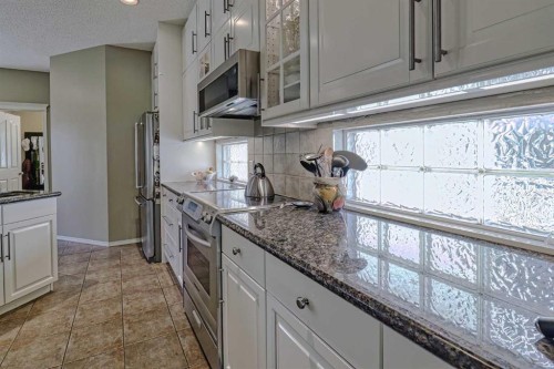 111 West Springs Way Sw, Calgary, AB - Indoor Photo Showing Kitchen With Upgraded Kitchen
