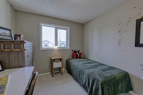 111 West Springs Way Sw, Calgary, AB - Indoor Photo Showing Bedroom