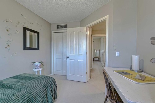111 West Springs Way Sw, Calgary, AB - Indoor Photo Showing Bedroom