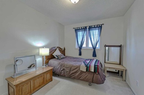 111 West Springs Way Sw, Calgary, AB - Indoor Photo Showing Bedroom