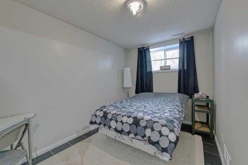 111 West Springs Way Sw, Calgary, AB - Indoor Photo Showing Bedroom