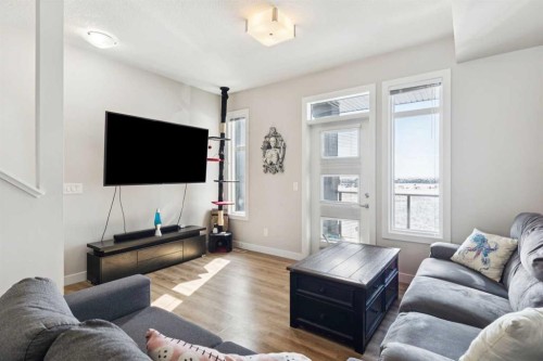 116 Seton Passage Se, Calgary, AB - Indoor Photo Showing Living Room