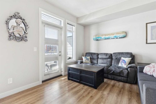 116 Seton Passage Se, Calgary, AB - Indoor Photo Showing Living Room