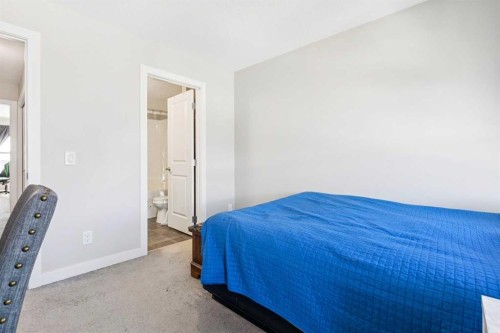 116 Seton Passage Se, Calgary, AB - Indoor Photo Showing Bedroom