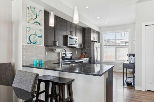 116 Seton Passage Se, Calgary, AB - Indoor Photo Showing Kitchen With Upgraded Kitchen