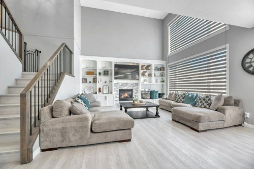 712 East Chestermere Drive, Chestermere, AB - Indoor Photo Showing Living Room With Fireplace