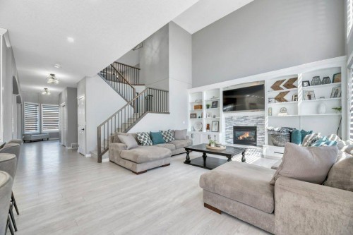 712 East Chestermere Drive, Chestermere, AB - Indoor Photo Showing Living Room With Fireplace