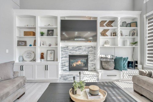 712 East Chestermere Drive, Chestermere, AB - Indoor Photo Showing Living Room With Fireplace