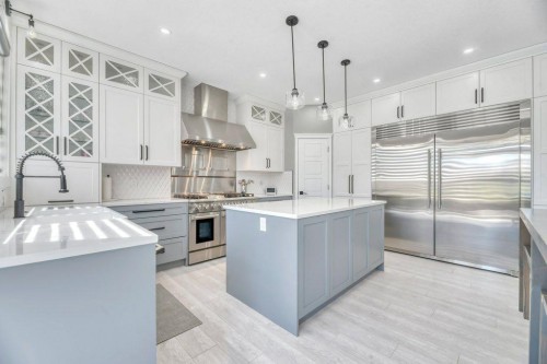 712 East Chestermere Drive, Chestermere, AB - Indoor Photo Showing Kitchen With Double Sink With Upgraded Kitchen