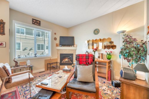 131-300 Marina Drive, Chestermere, AB - Indoor Photo Showing Living Room With Fireplace