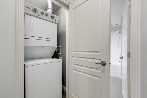 7-181 Rockyledge View Nw, Calgary, AB - Indoor Photo Showing Laundry Room