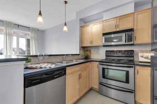 7-181 Rockyledge View Nw, Calgary, AB - Indoor Photo Showing Kitchen With Double Sink