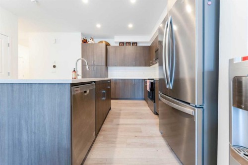 317 Baneberry Way Sw, Airdrie, AB - Indoor Photo Showing Kitchen With Stainless Steel Kitchen With Upgraded Kitchen