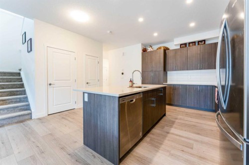 317 Baneberry Way Sw, Airdrie, AB - Indoor Photo Showing Kitchen With Stainless Steel Kitchen