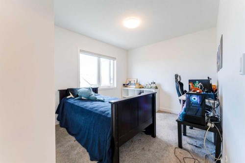 317 Baneberry Way Sw, Airdrie, AB - Indoor Photo Showing Bedroom