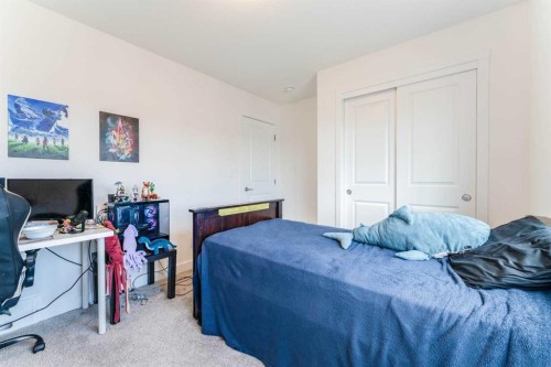 317 Baneberry Way Sw, Airdrie, AB - Indoor Photo Showing Bedroom