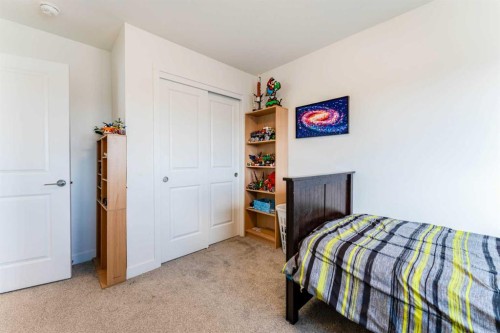 317 Baneberry Way Sw, Airdrie, AB - Indoor Photo Showing Bedroom