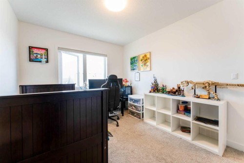 317 Baneberry Way Sw, Airdrie, AB - Indoor Photo Showing Bedroom