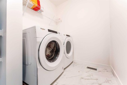 317 Baneberry Way Sw, Airdrie, AB - Indoor Photo Showing Laundry Room