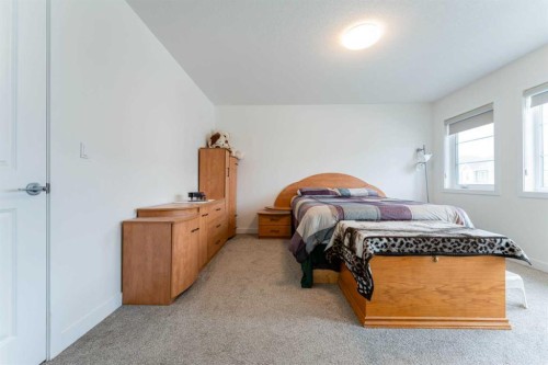 317 Baneberry Way Sw, Airdrie, AB - Indoor Photo Showing Bedroom