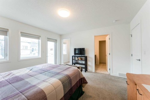 317 Baneberry Way Sw, Airdrie, AB - Indoor Photo Showing Bedroom
