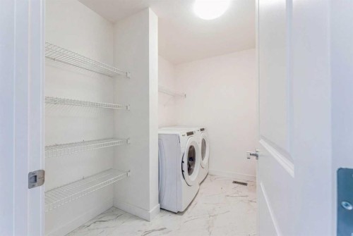317 Baneberry Way Sw, Airdrie, AB - Indoor Photo Showing Laundry Room