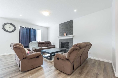 107 Dawson Harbour Court, Chestermere, AB - Indoor Photo Showing Living Room With Fireplace
