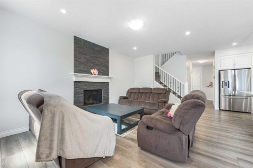 107 Dawson Harbour Court, Chestermere, AB - Indoor Photo Showing Living Room With Fireplace