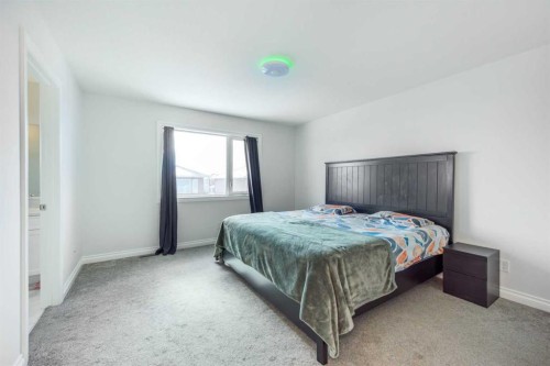 107 Dawson Harbour Court, Chestermere, AB - Indoor Photo Showing Bedroom