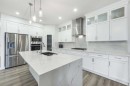 107 Dawson Harbour Court, Chestermere, AB  - Indoor Photo Showing Kitchen With Stainless Steel Kitchen With Double Sink With Upgraded Kitchen 