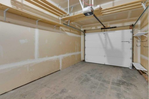 305-413 River Avenue, Cochrane, AB - Indoor Photo Showing Garage