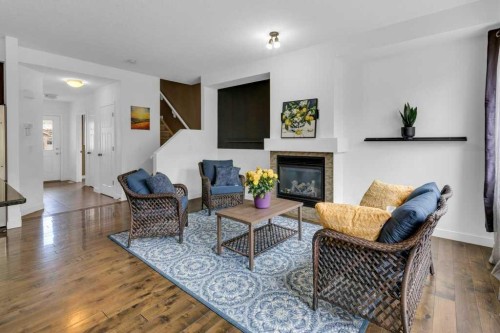 305-413 River Avenue, Cochrane, AB - Indoor Photo Showing Living Room With Fireplace